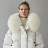 White puffer jacket with white faux fur collar and front zipper, worn by model