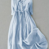 Light blue button-front tie-waist dress with 3/4 sleeves and gathered skirt.