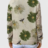 Back view of relaxed floral pullover, cream knit with green flower pattern, long sleeves