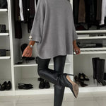 Gray knit pullover with relaxed silhouette and round neckline