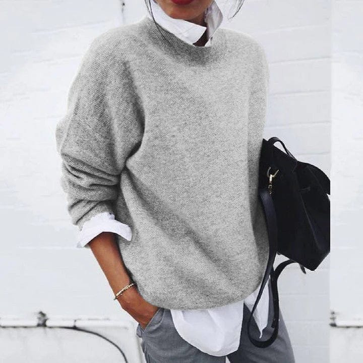 Soft crewneck pullover sweater in light gray, long sleeves.