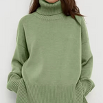 Light green turtleneck sweater with long sleeves and ribbed hem