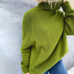 Green rollneck sweater with ribbed cuffs and cozy knit texture