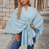 Light blue draped poncho with V-neck and gathered front knot, wide cape sleeves