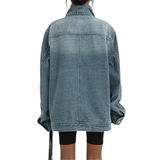 Back view of vintage-washed denim jacket with high collar and center seam