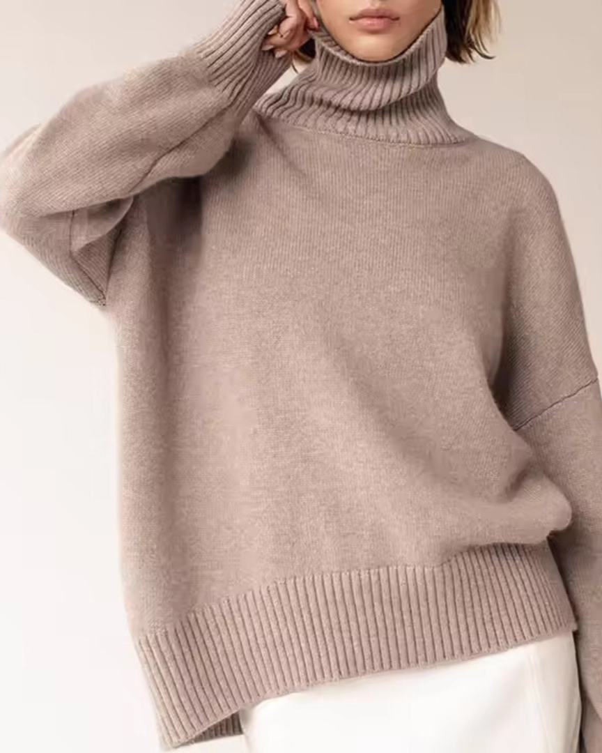 Oversized taupe turtleneck knit sweater with ribbed collar and cuffs