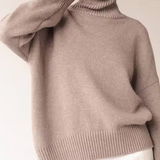 Oversized taupe turtleneck knit sweater with ribbed collar and cuffs