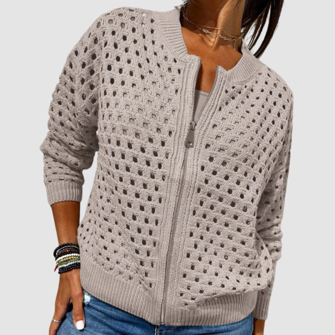 Light beige knit cardigan with full-zip front and textured dotted pattern, ribbed hem.