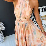 Peach watercolor halter maxi dress with gathered waist and high neckline