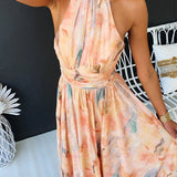 Peach watercolor halter maxi dress with gathered waist and high neckline