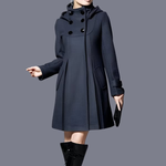 Dark long hooded coat with double-breasted button front and slant side pockets