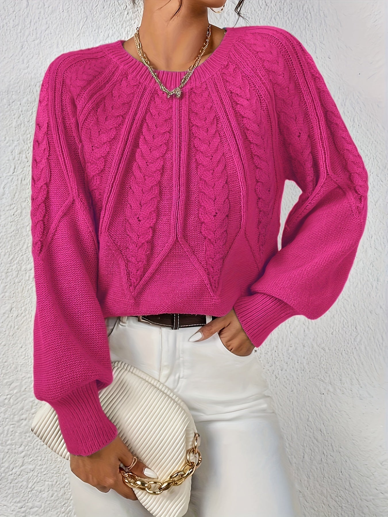 Fuchsia cable-knit long-sleeve pullover with half-zip neckline and ribbed cuffs