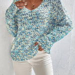 Loose knit pullover sweater with long sleeves, blue-and-white speckled texture