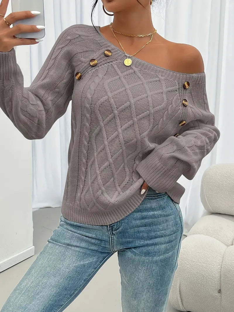 Gray cable-knit long-sleeve sweater with wide neckline and gold button accents