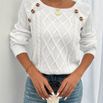 White cable-knit crewneck sweater with decorative shoulder buttons and ribbed cuffs