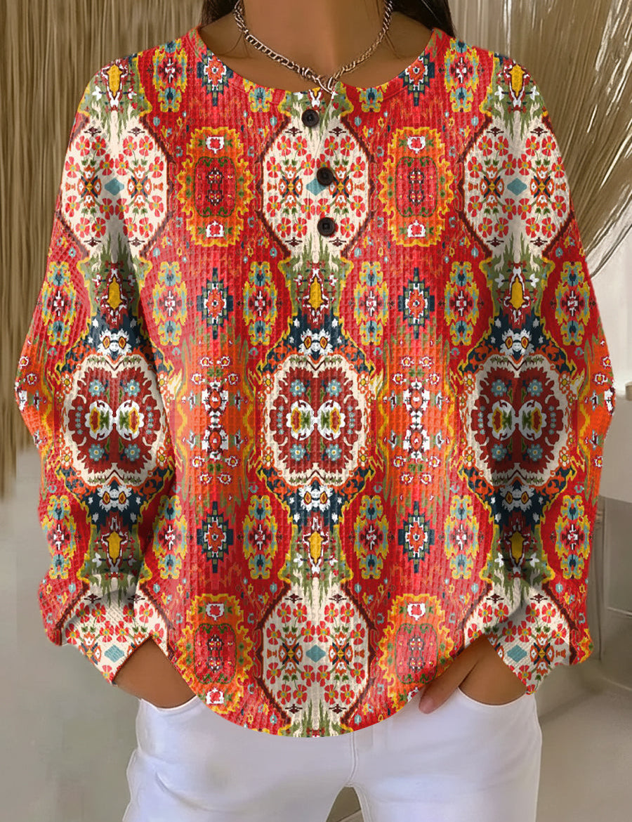 Orange ethnic floral pullover with long sleeves and button-front placket