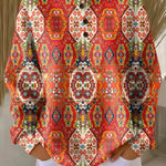 Orange ethnic floral pullover with long sleeves and button-front placket