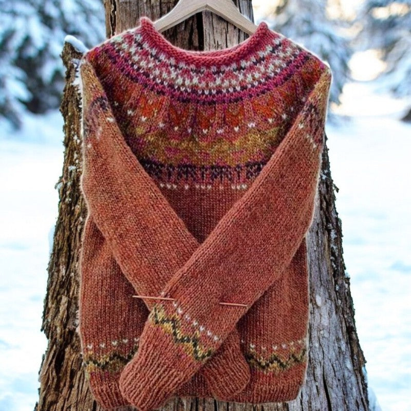 Red knit pullover sweater with crew neck, fair isle yoke, and ribbed cuffs