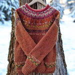 Red knit pullover sweater with crew neck, fair isle yoke, and ribbed cuffs