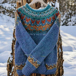 Blue knit pullover with crew neck, long sleeves, and multicolor zigzag yoke