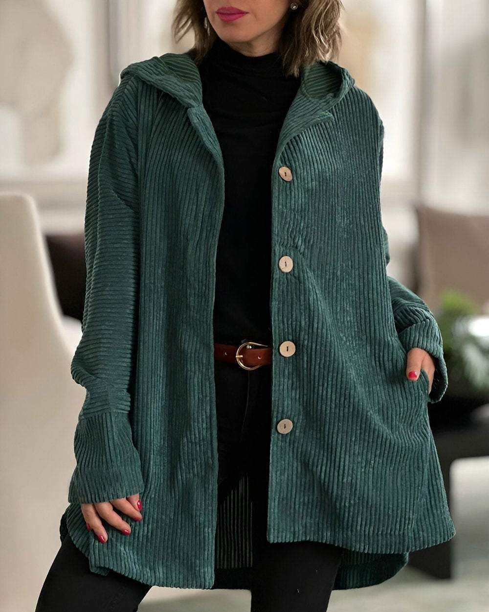 Green corduroy hooded jacket with button front and side pockets