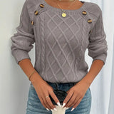 Gray cable-knit long-sleeve sweater with round neckline and gold button accents