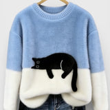 Light blue and white two-tone sweatshirt with black cat graphic on the front