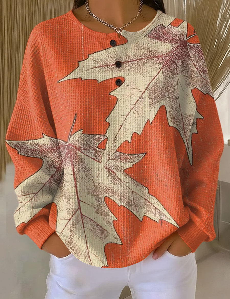 Maja™ warm pullover sweatshirt with orange leaf print, crew neckline, buttoned placket