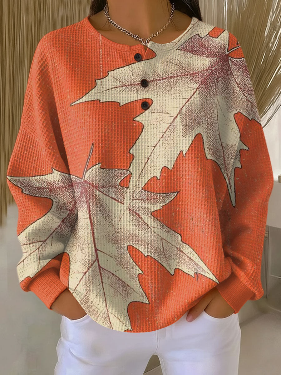 Maja™ warm pullover sweatshirt with orange leaf print, crew neckline, buttoned placket