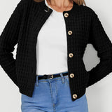 Womens knit cardigan with button front, black textured knit and long sleeves