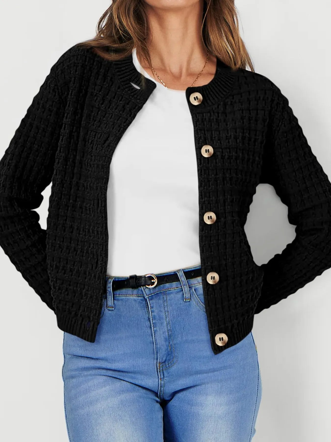 Womens knit cardigan with button front, black textured knit and long sleeves