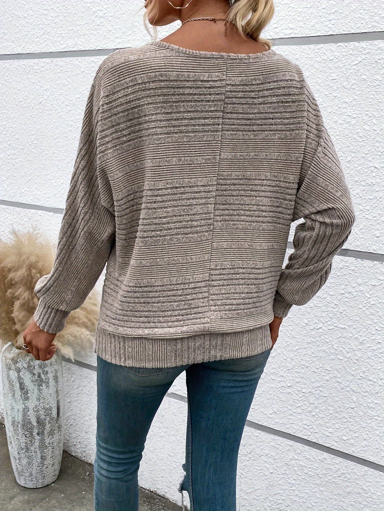 Khaki striped knit pullover with batwing sleeves, ribbed cuffs and hem