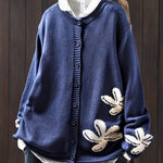 Navy blue floral knit cardigan sweater with button front and ribbed cuffs