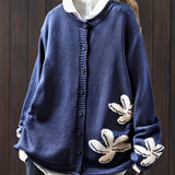 Navy blue floral knit cardigan sweater with button front and ribbed cuffs
