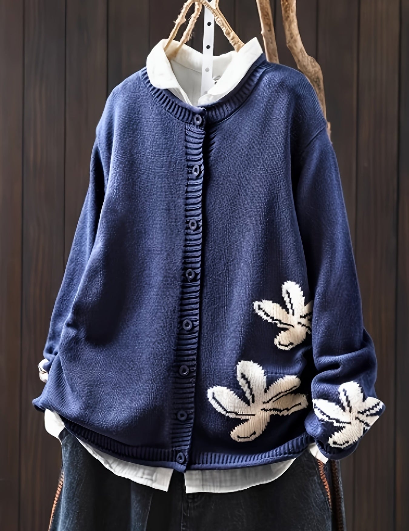 Navy blue floral knit cardigan sweater with button front and ribbed cuffs