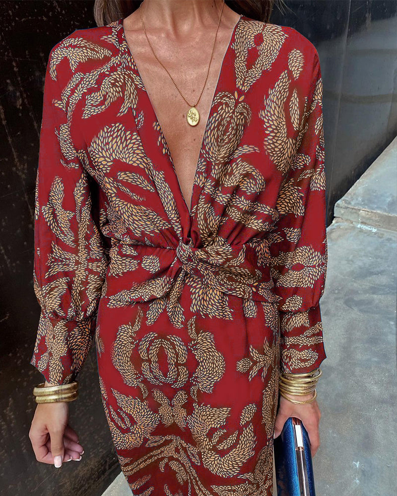 Red patterned V-neck midi dress with knotted front and long sleeves