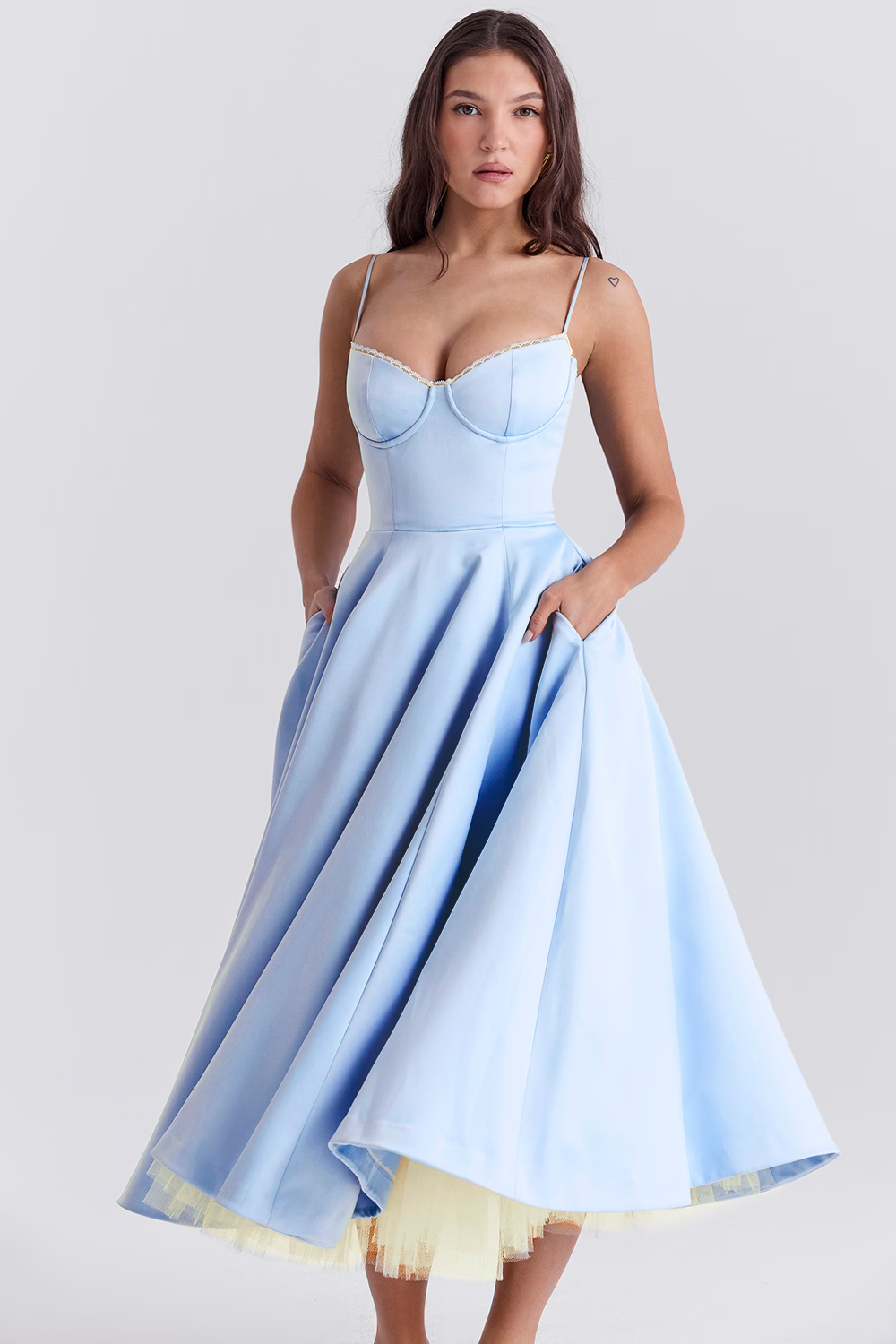 Light blue corset bodice dress with thin straps and full flared midi skirt