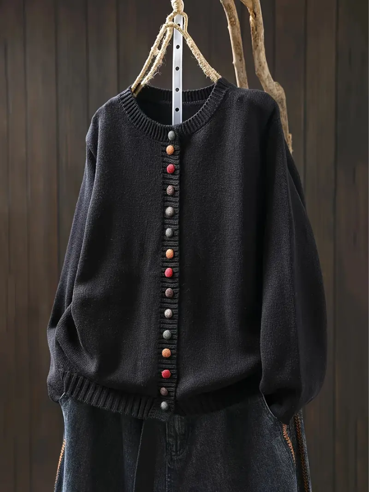Dark charcoal knit cardigan with round neckline and multicolor button-front placket.