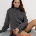 Dark gray ribbed turtleneck sweater with long sleeves and side seam detail