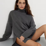 Dark gray ribbed turtleneck sweater with long sleeves and side seam detail