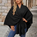 Black draped poncho with twist-knot front and wide sleeves