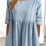 Light blue dress bodice with crew neckline and gathered waist seam