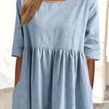 Light blue dress bodice with crew neckline and gathered waist seam