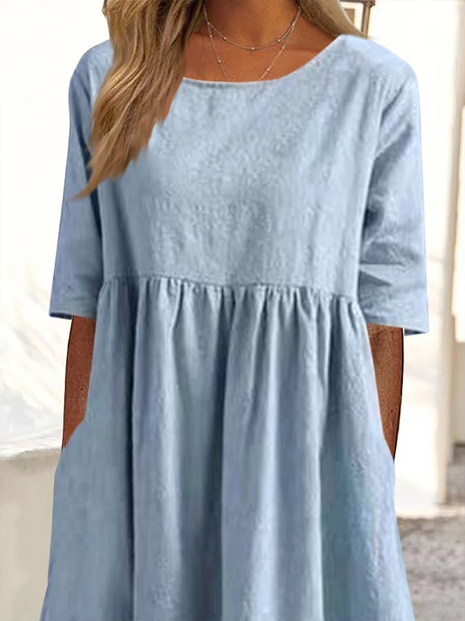 Light blue dress bodice with crew neckline and gathered waist seam