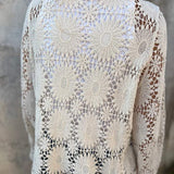 White lace cardigan back with allover daisy crochet pattern and long sleeves