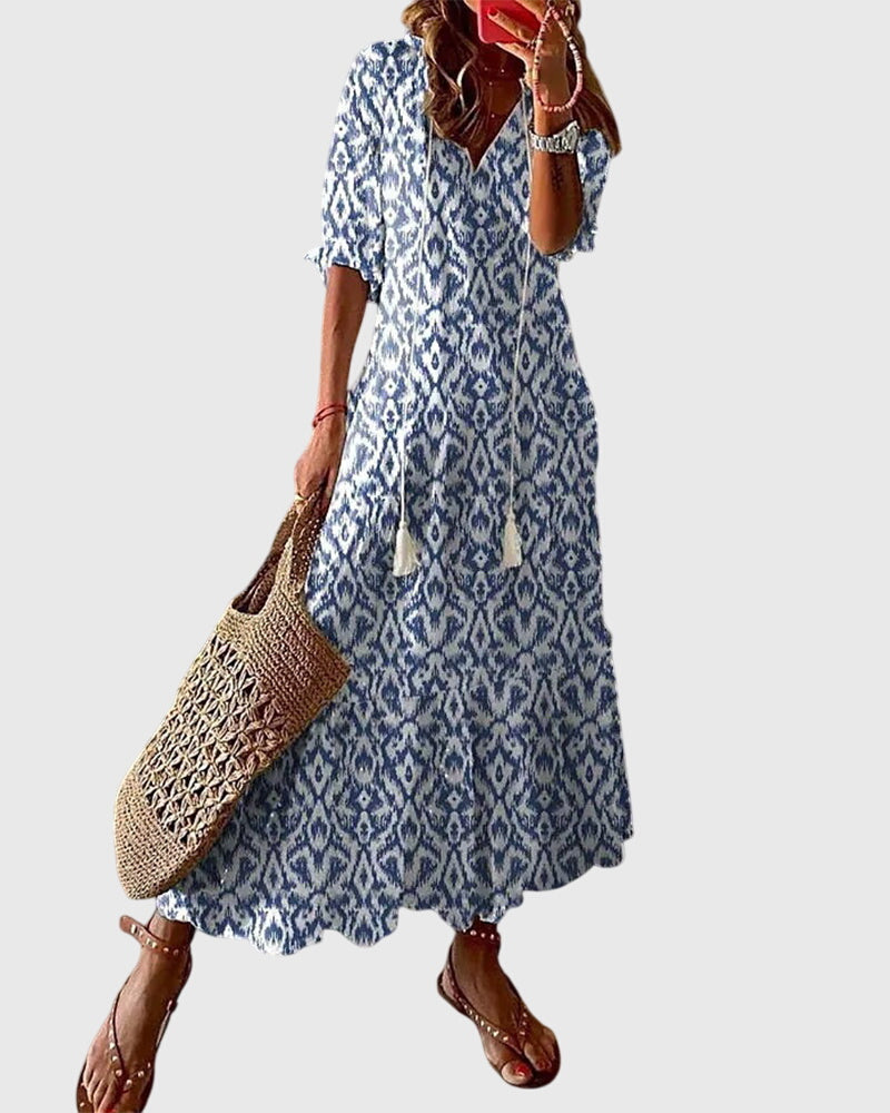 Blue bohemian midi dress with diamond ikat print, short sleeves and V-neck