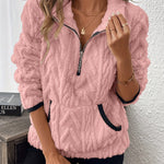 Pink fuzzy quarter-zip pullover with short sleeves and navy-trim accents