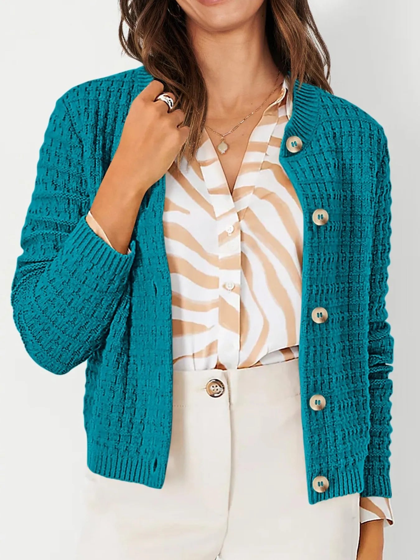 Teal textured knit cardigan with wood-style buttons and open collar detail, side view