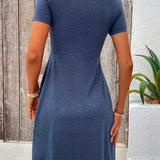 Blue short-sleeve dress, back view, fitted waist with flared skirt
