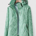 Green hooded jacket with front zipper and stand collar, leaf-patterned design
